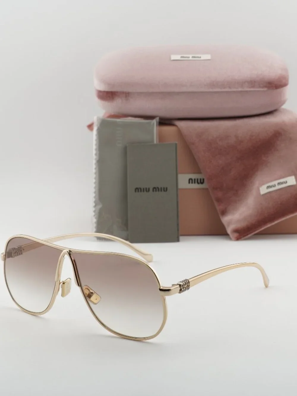 Miu Miu MUA56S 5AK90L Sunglasses Gold Geometric Frame, Brown Lenses
